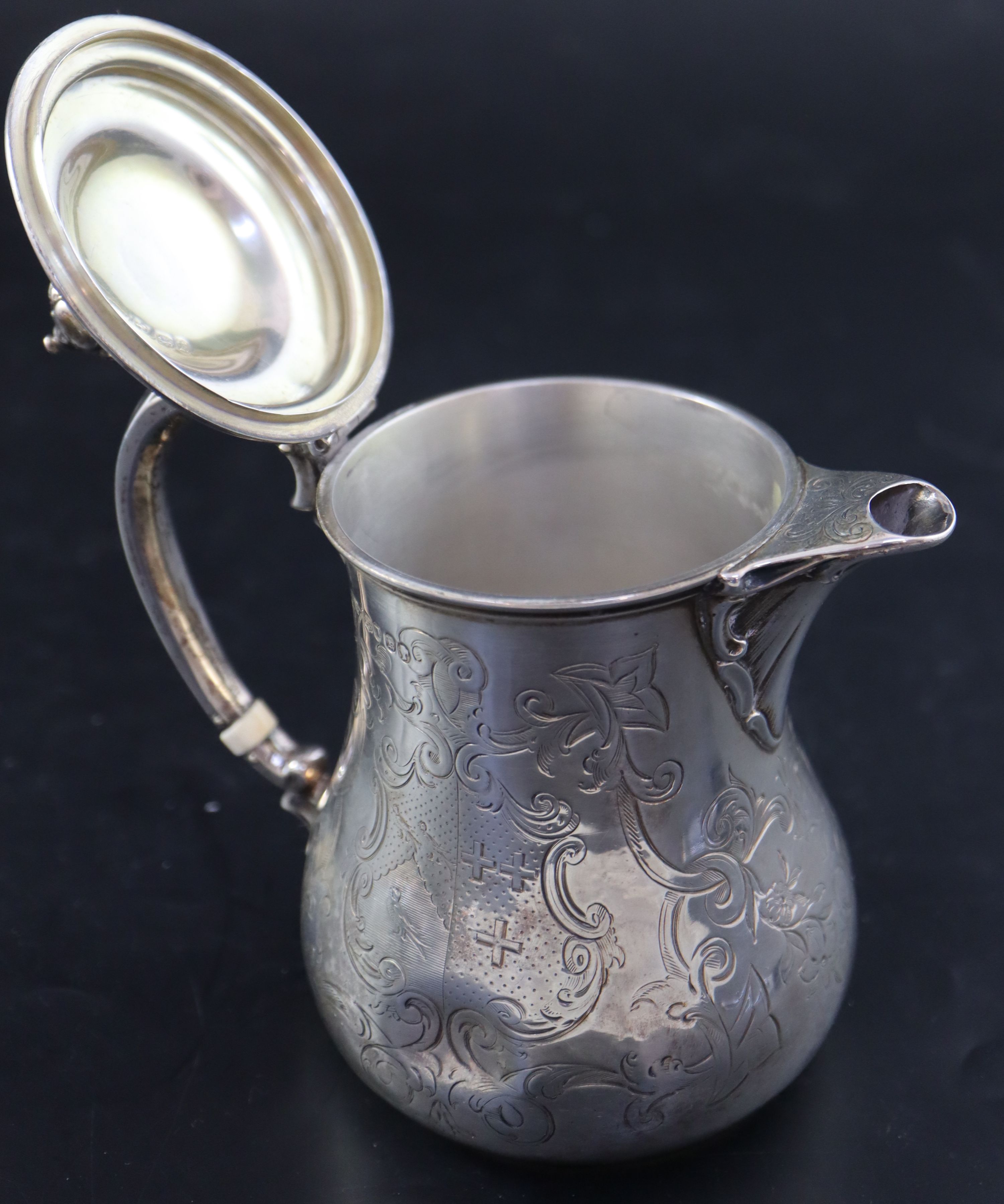 A Victorian small engraved silver hot water pot, 5.7cm, gross 10.5oz.